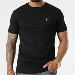 Tout neuf 🧨 Tee 👚 Shirt Essential Broderie Gold 7318 Noir Doré de Calvin Klein 🎉